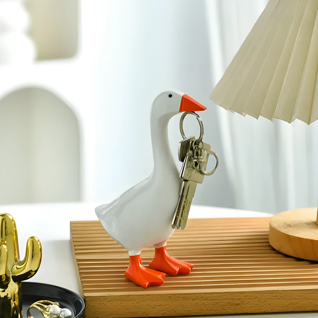 White simulated duck magnetic resin ornament on a fridge door