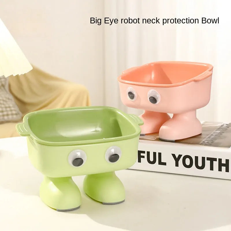 Green robot-shaped elevated cat bowl with 15-degree tilt and detachable inner dish