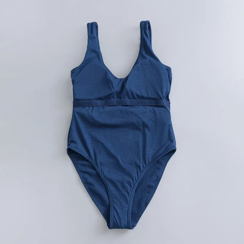 Navy blue women's one-piece swimsuit with triangle slimming shape and removable chest pads