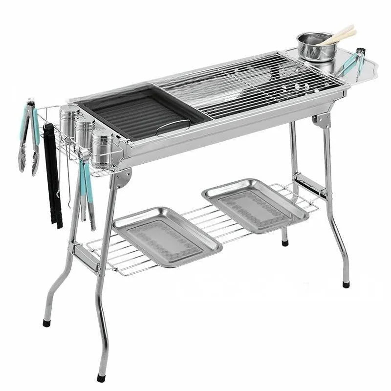 Stainless steel portable folding barbecue grill oven for outdoor cooking.