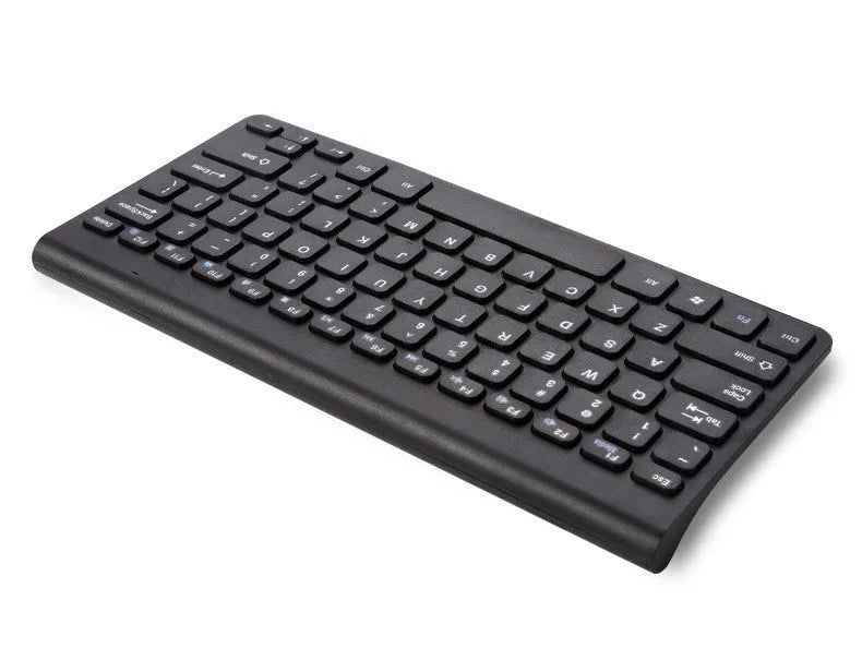 Black and white 2.4 GHz wireless keyboard and mouse set with USB receiver on a desk.