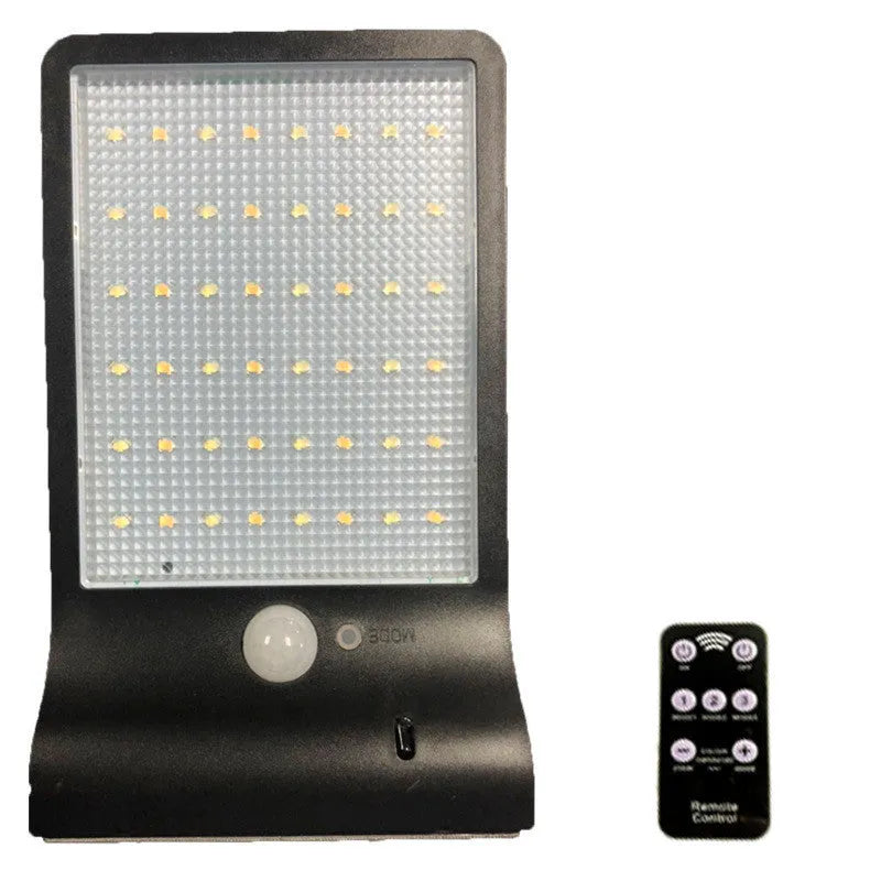 Black and white outdoor solar garden light with solar panel and IP65 waterproof rating.