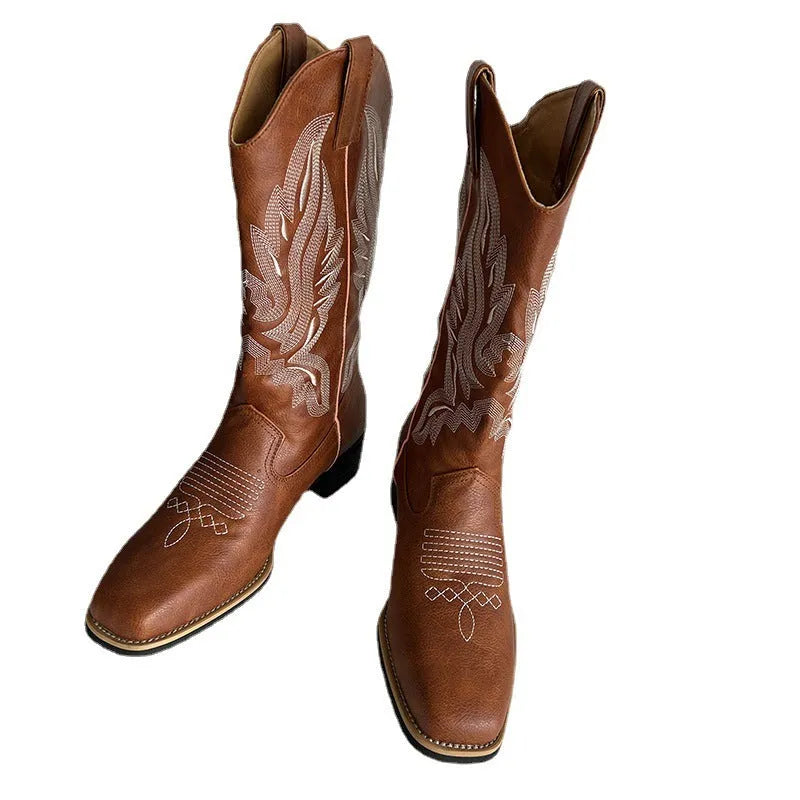 Brown embroidered women's mid-calf Martin boots with leather lining and a low square heel.