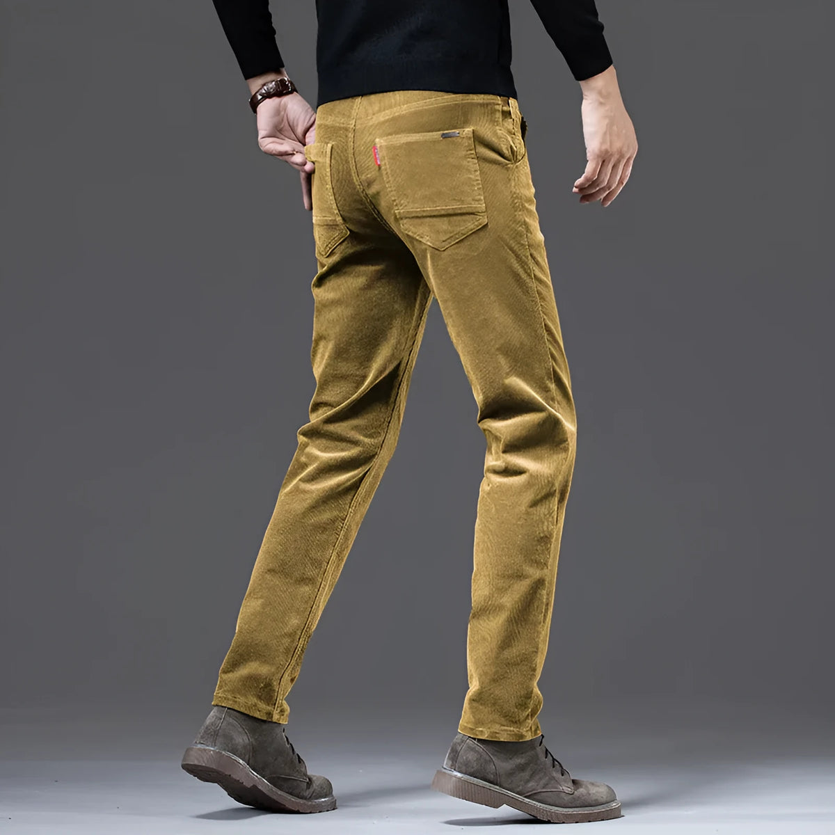 Straight slim-fit cotton corduroy trousers in black, side view, mid-waist, zip-placket fly