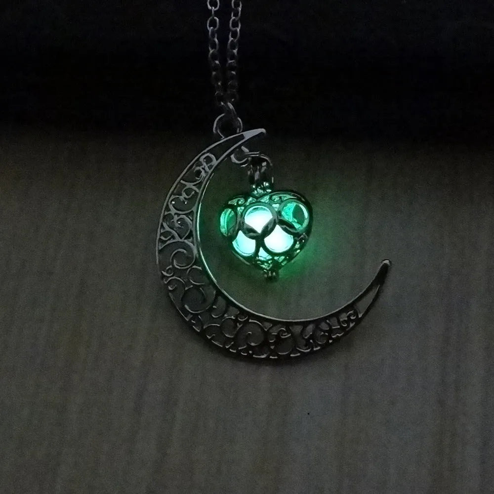 Glowing pendant necklace with silver plated chain and luminescent glow in dark, 3.6cm wide pendant