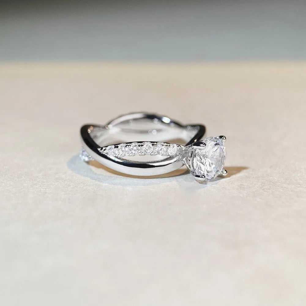 Silver moissanite ring with twisted arm geometric design and 1 carat centre stone