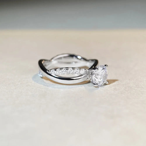 Silver moissanite ring with twisted arm geometric design and 1 carat centre stone