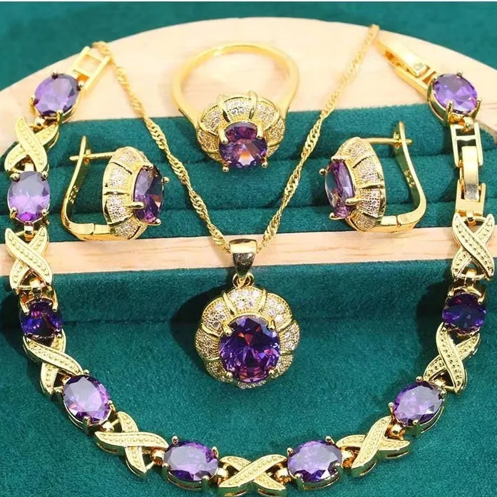 Complete 18k gold plated jewellery set showing necklace, earrings, ring and bracelet with multi-coloured cubic zirconia stones.