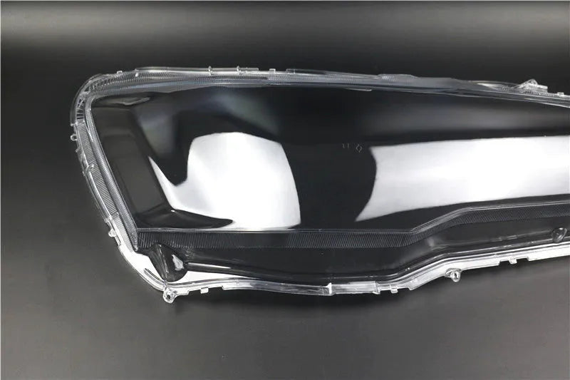 Transparent plastic headlight housing covers for driver and passenger positions