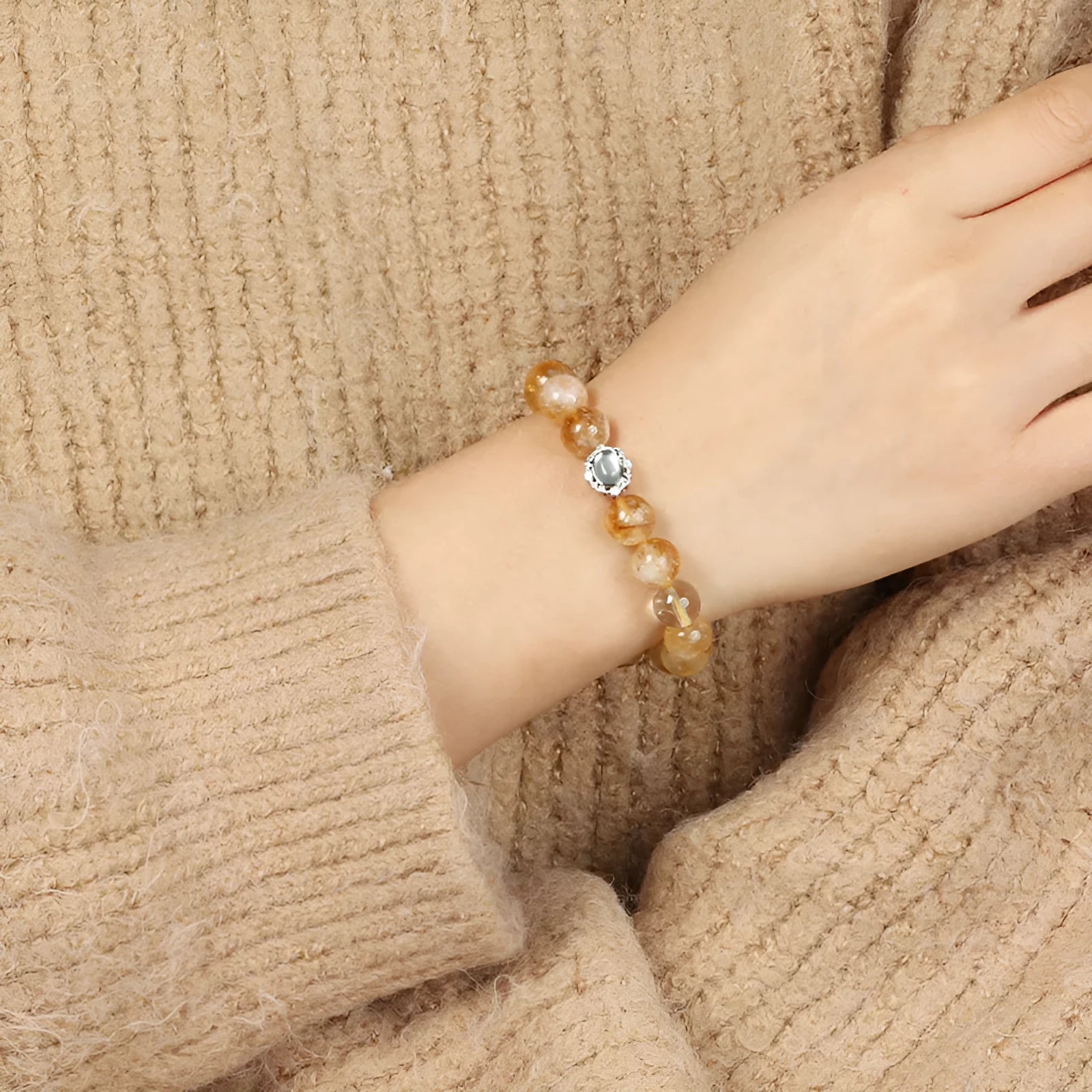 Citrine crystal bracelet with 10mm geometric beads on wrist