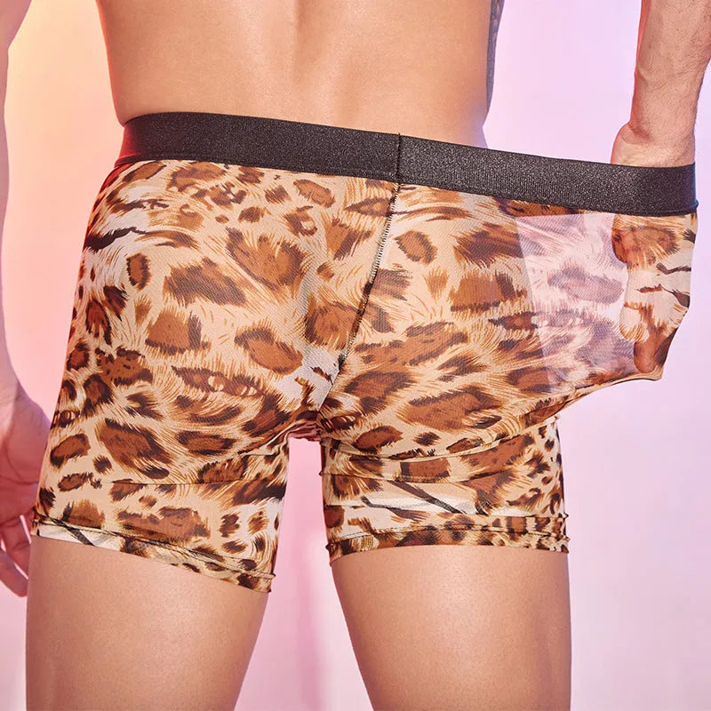 Men's leopard print nylon boxer shorts laid flat, showing the full animal pattern.