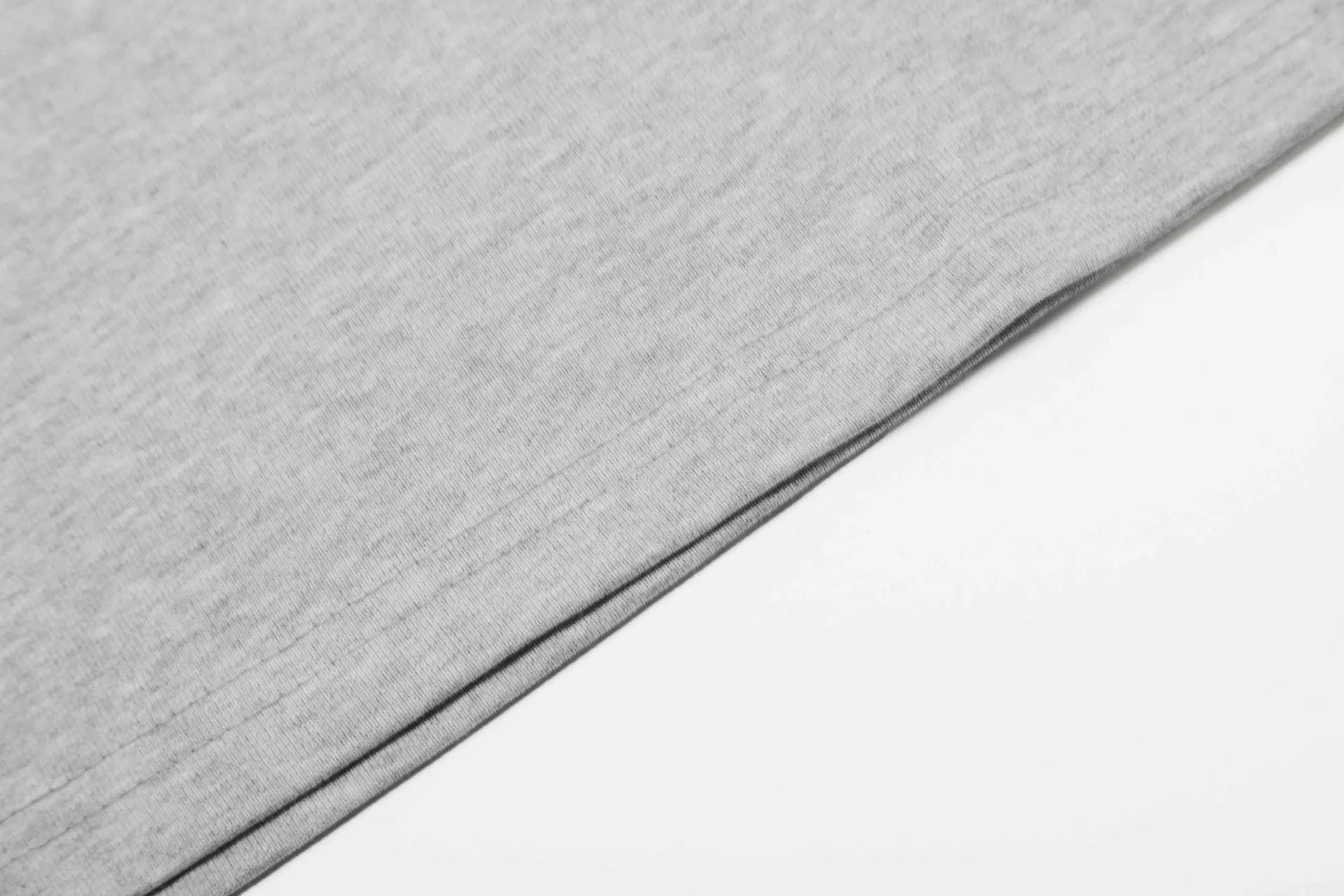 A man's loose-fit cotton pullover hoodie in a simple retro style, shown in grey colour.