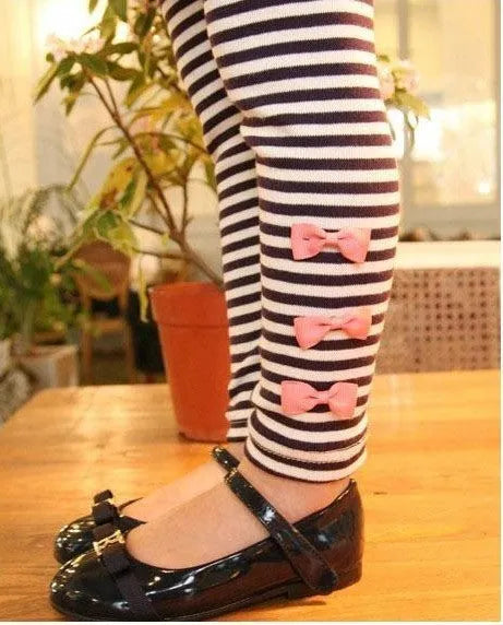 Girls' pink cotton two-piece clothing set shown in sizes 110cm, 120cm, 130cm, and 140cm