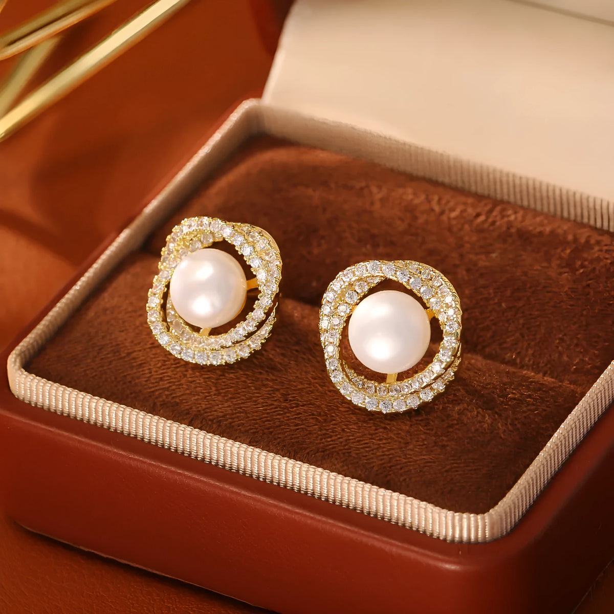 Natural pearl winding ear studs with real gold plating on copper base geometric round design