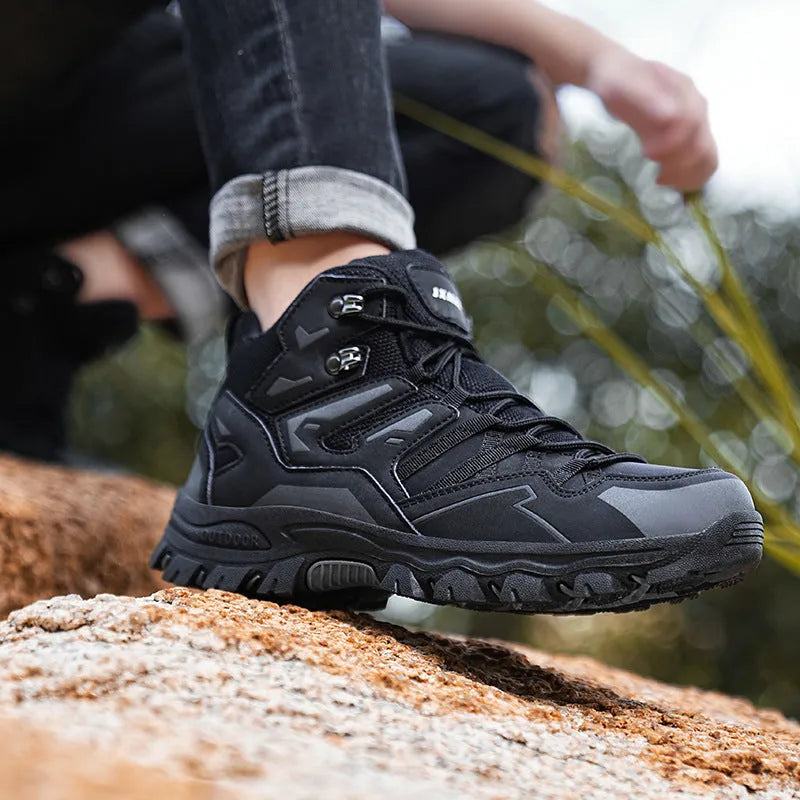 Low-top hiking sneakers in multiple colours with rubber sole and lace-up front for outdoor wear.