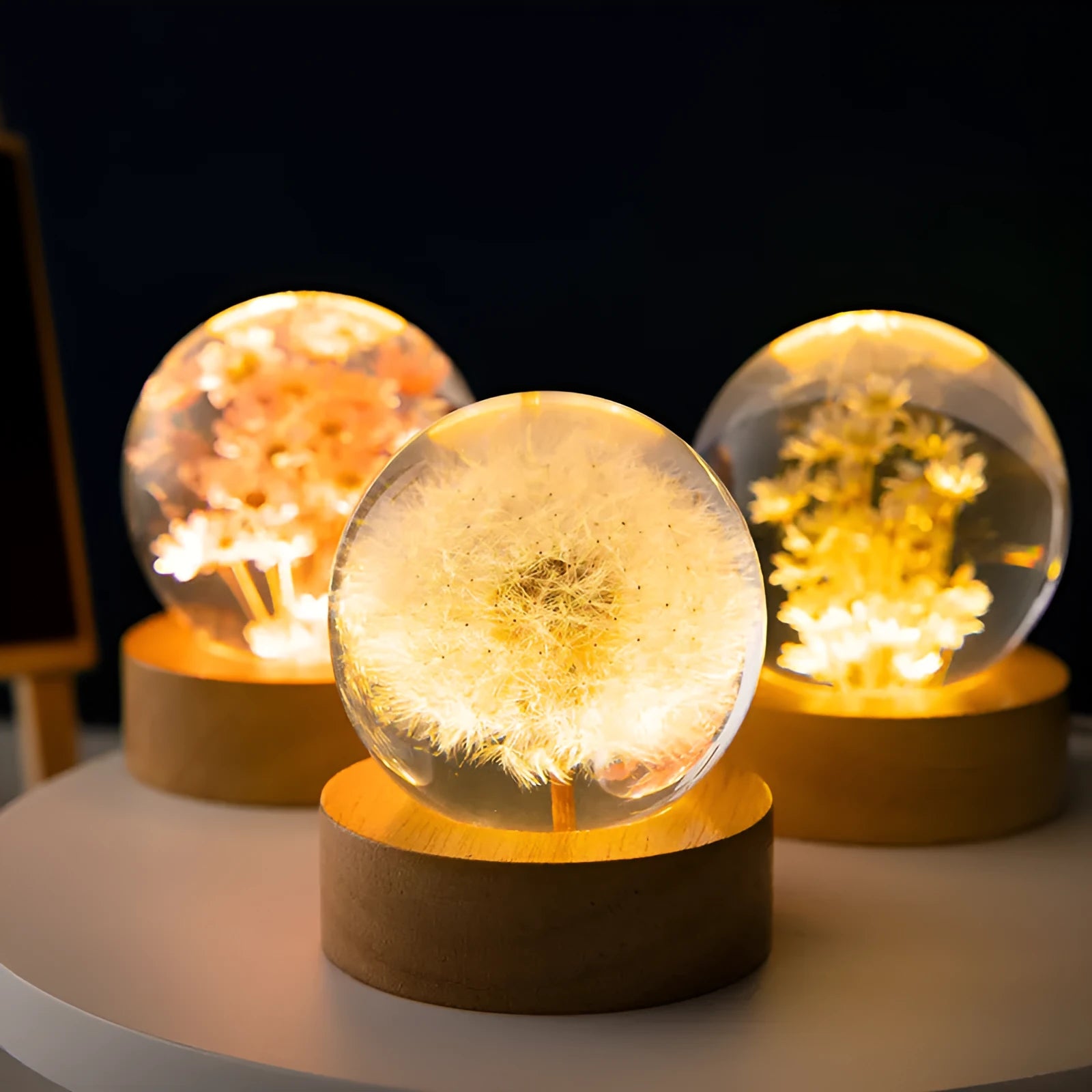 3D dandelion crystal ball LED night light on a beech wood stand, showing USB cable.