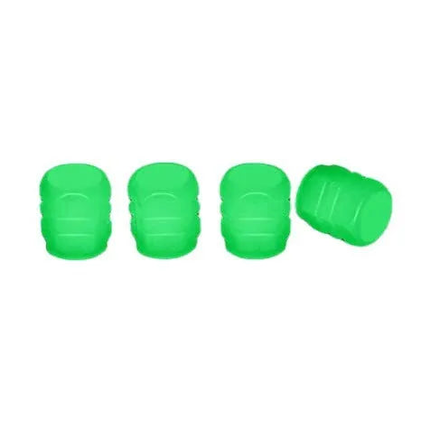 Luminous rubber tyre valve caps in light green, blue, red, yellow, and pink colours on a wheel valve.