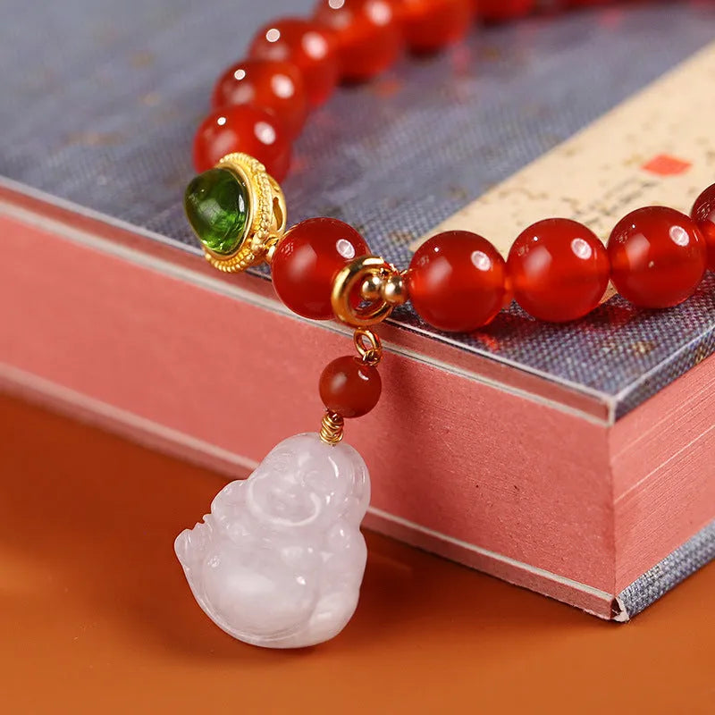 Red agate bracelet with amber accents and geometric Maitreya Buddha charm