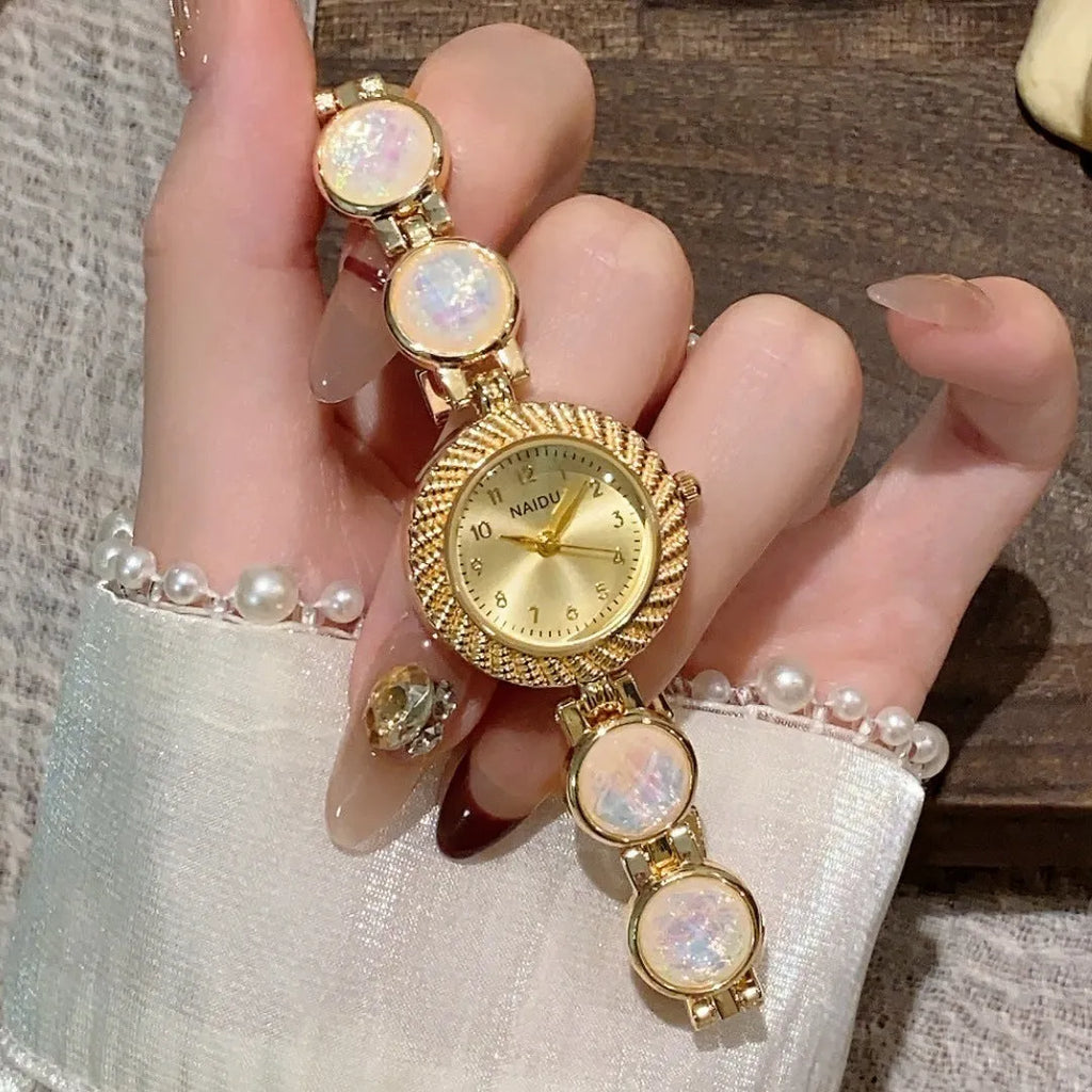 Women's round 25mm quartz watch with zinc alloy case in one of six colour options.