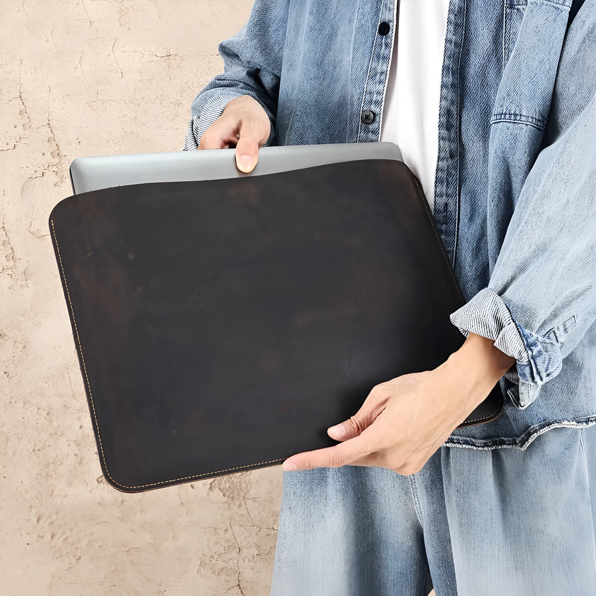 Crazy Horse leather horizontal computer liner bag in brown showing first layer cowhide construction