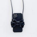 Ladies crossbody bag phone case in black with bow and strap showing iPhone in case front view