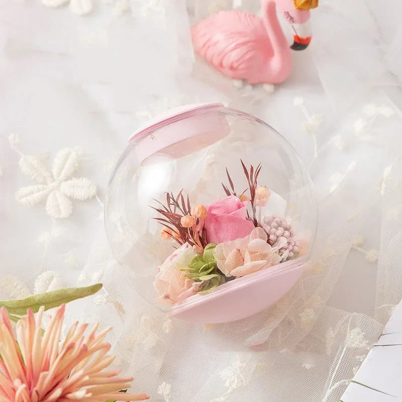 Pink preserved rose ornament with optional Bluetooth audio base and multiple plug options
