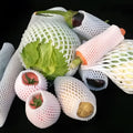 White foam net protective sleeve for apples and oranges, shown in various sizes.