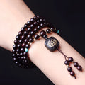 Zambia rosewood Buddha beads bracelet with flat lotus pendant showing 108 wooden beads