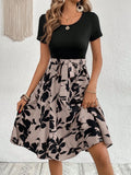 Women's khaki dress with floral printing, lace-up front, and A-line silhouette