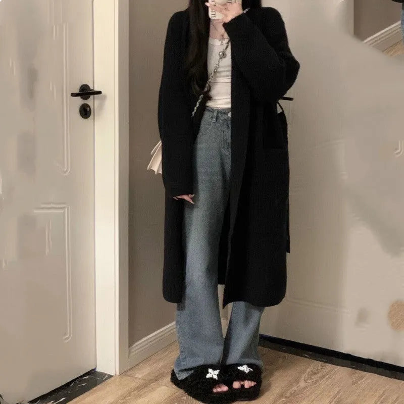 Women's loose chenille knitted cardigan with 3D pattern in dark grey colour showing 65cm length