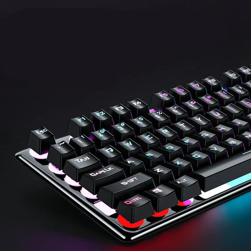 Black three-piece Steampunk Manipulator wired gaming keyboard, mouse and headset set on a desk