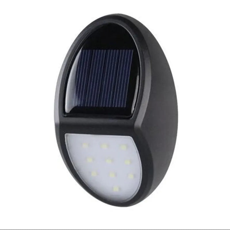 Black solar-powered LED wall light with motion sensor for outdoor security and garden lighting