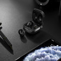 Transparent clamshell Bluetooth ear case in moulded plastic, available in translucent gold, black, and purple
