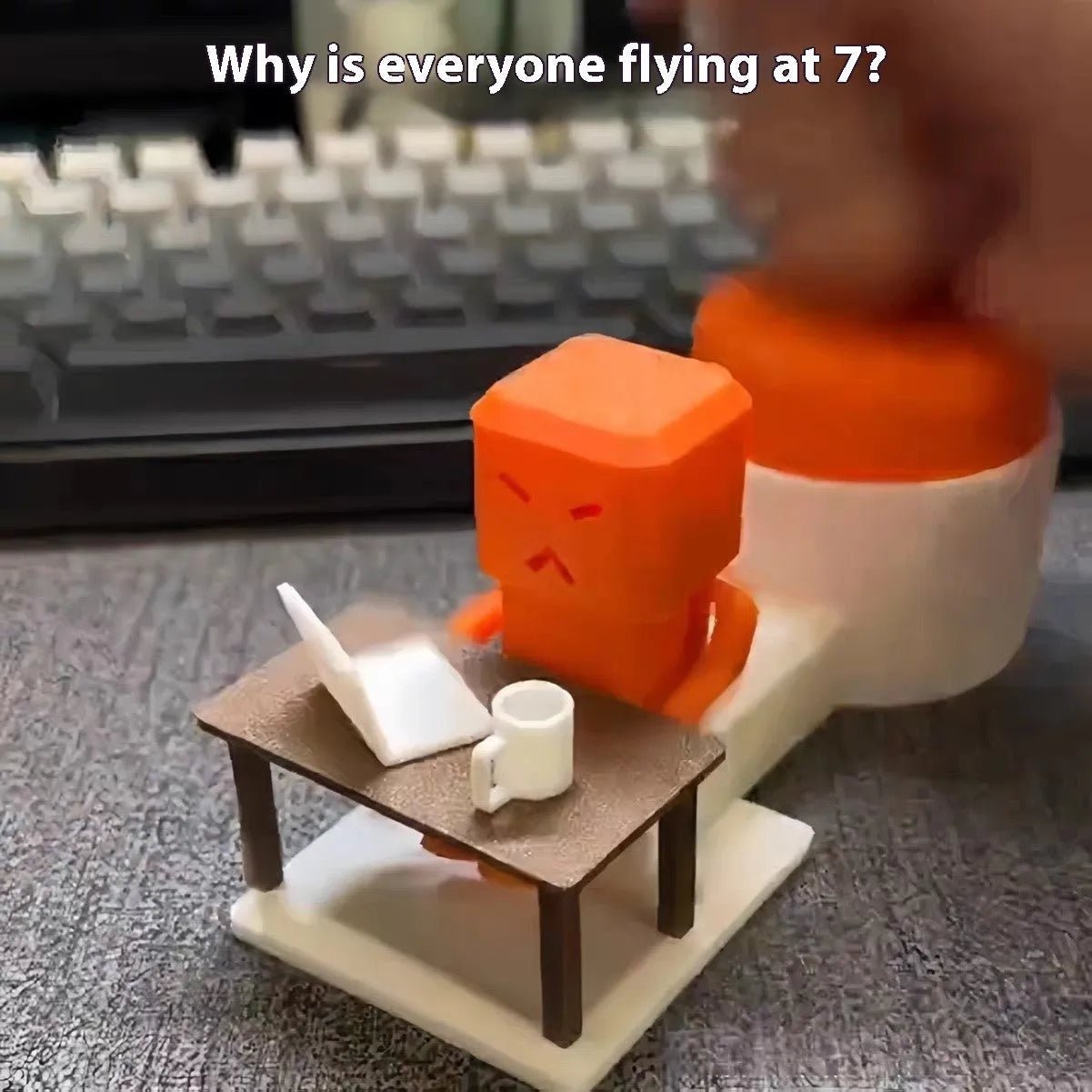 Orange plastic table turning decompression toy on desktop surface