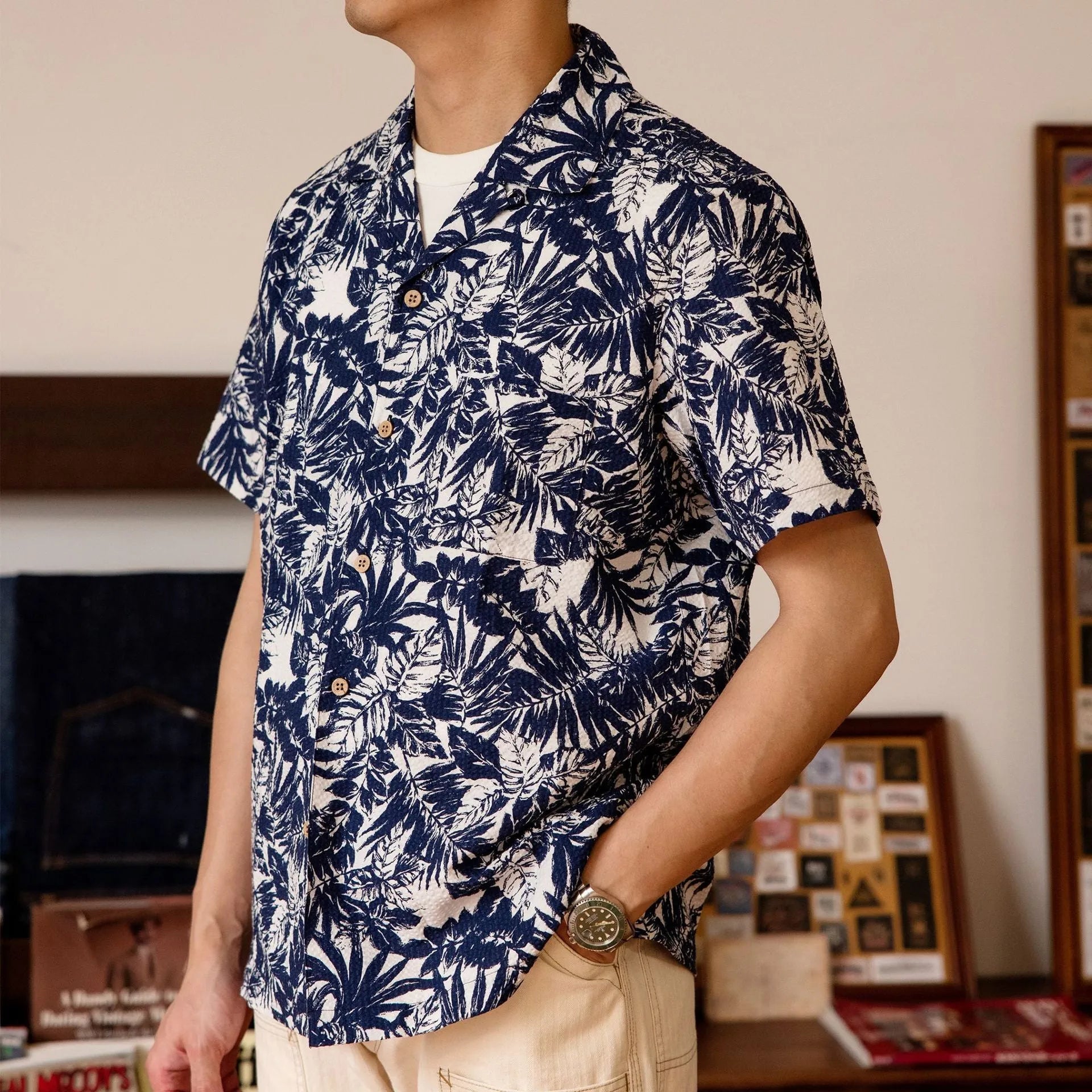 Vintage floral print seersucker shirt with a Cuban collar on a mannequin, showing loose cardigan fit.