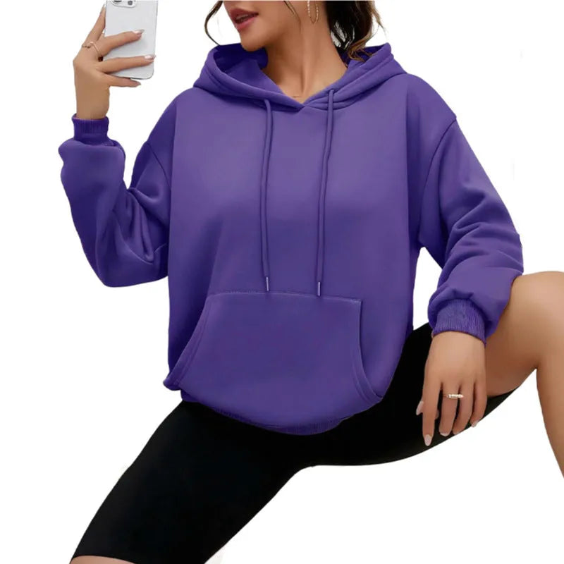 Women's loose grey drawstring pocket sweatshirt with long sleeves on a hanger