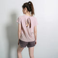 Women's short sleeve polyester sports T-shirt in black, shown flat.