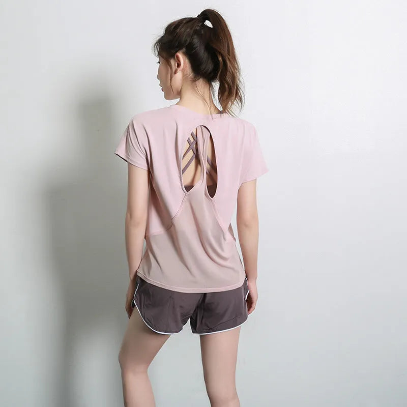 Women's short sleeve polyester sports T-shirt in black, shown flat.