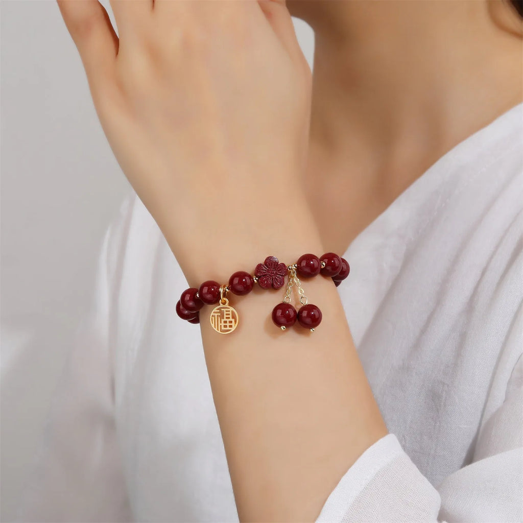 Retro women's cinnabar bracelet with Fu character charm in purple gold sand colour