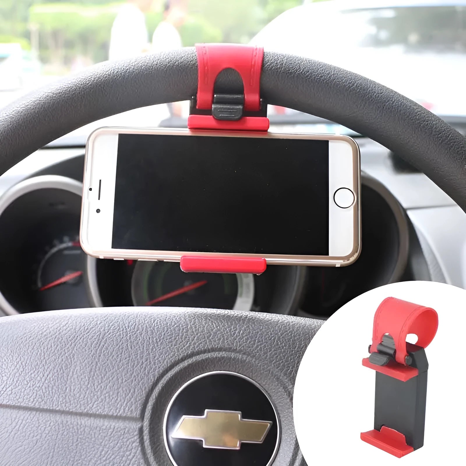 Black steering wheel phone holder clip mounted on car steering wheel holding smartphone