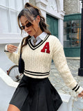 V-neck creamy white knitted shirt with slim stripes and patch detail on model