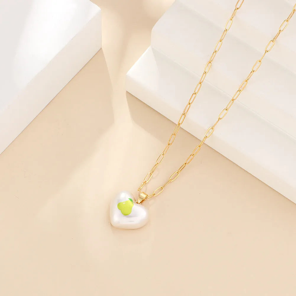 Geometric fruit pendant necklace on adjustable 21-50cm chain with strawberry, pineapple, apple, cherry, and pear colour options
