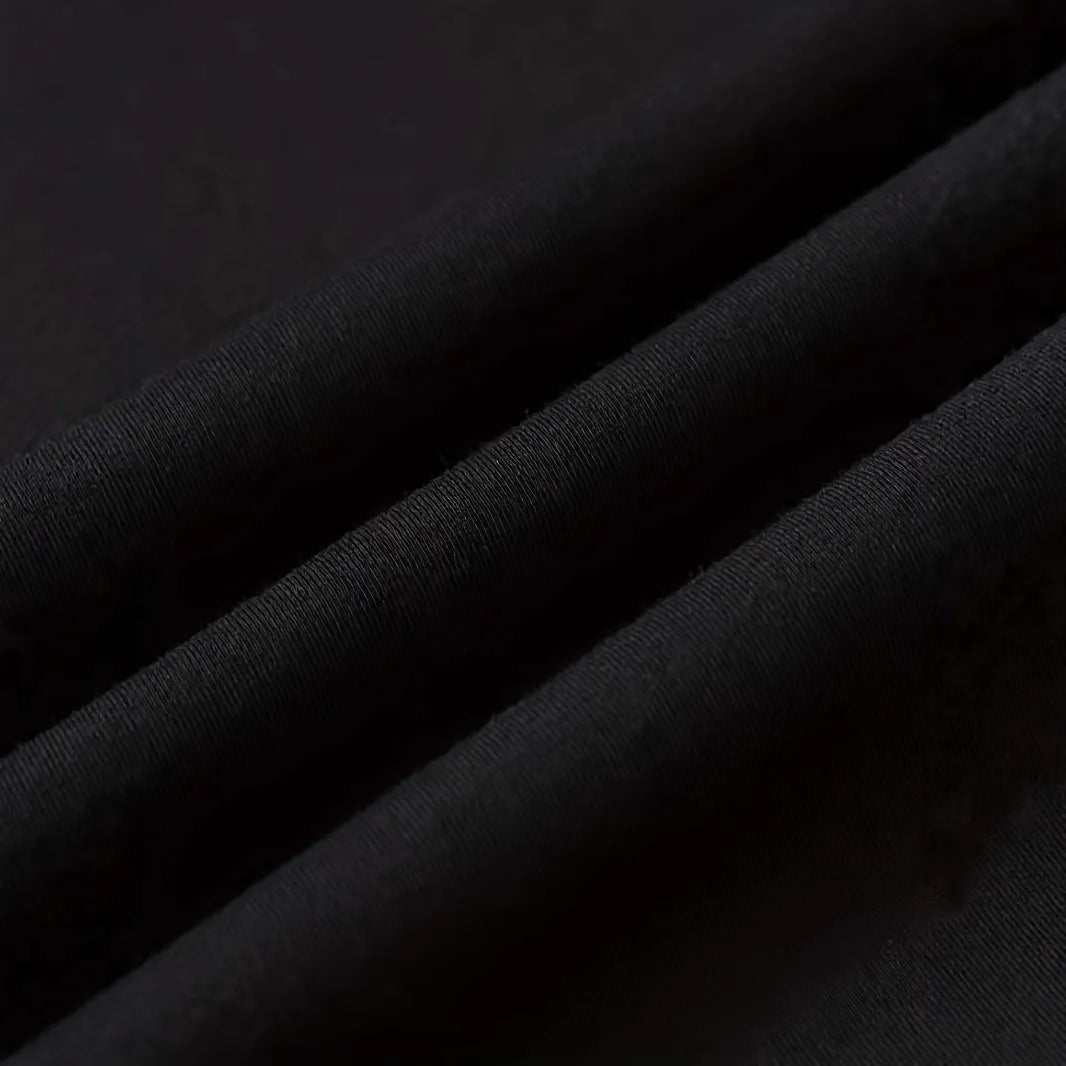 Men's short-sleeved loose fit cotton T-shirt in black pullover style on model