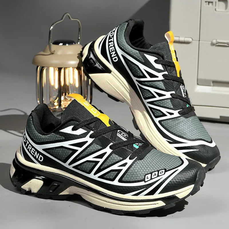 Low top hiking shoes in khaki with round toe, artificial leather upper, and flat rubber sole.