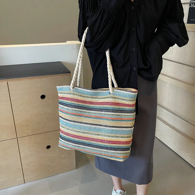 Blue straw woven nylon shoulder bag with polyester lining and single shoulder strap