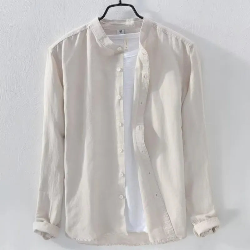 Man wearing a loose-fit light blue casual long sleeve shirt made from cotton linen fabric.