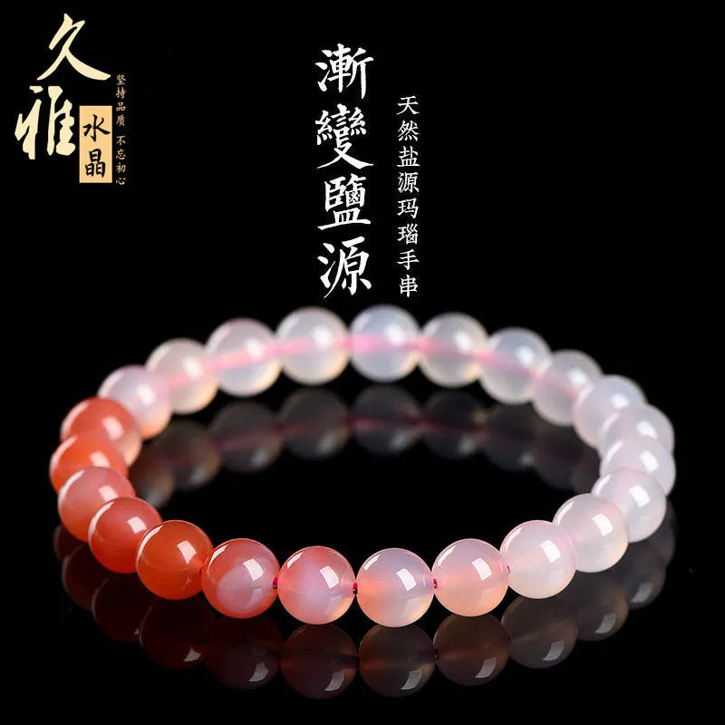 Yanyuan agate bracelet with gradient colours showing beads in a geometric style on a wrist.