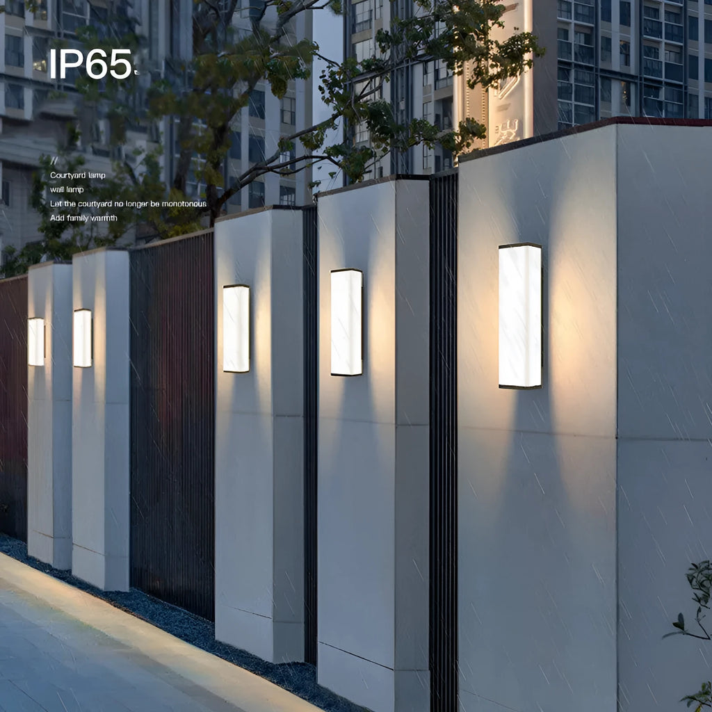 Vertical stainless steel outdoor wall light with polycarbonate diffuser, 60cm height.