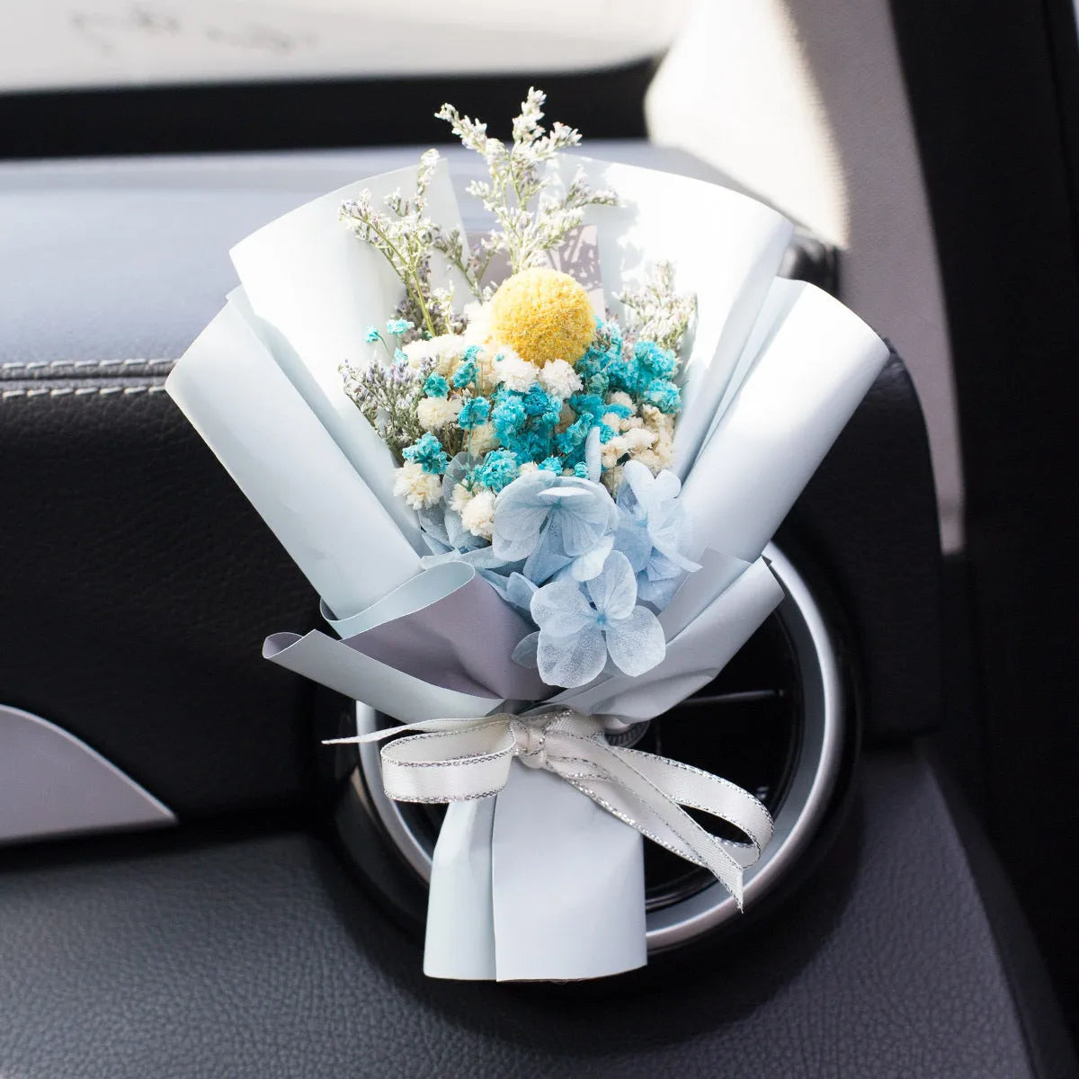 Handmade dried flower car air freshener ornament in multiple colours mounted on car vent