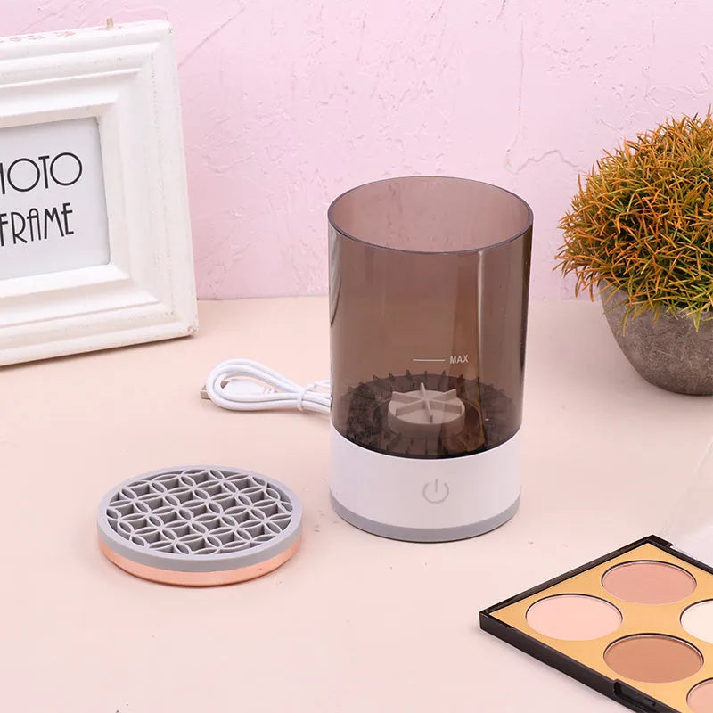 Electric makeup brush cleaner in grey and white, 17x9x9 cm, with USB charger and brush